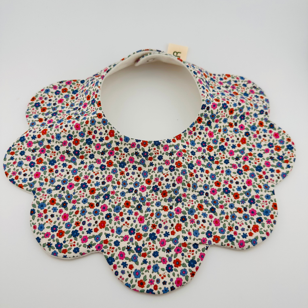 Scalloped Baby Bib – Red, Blue and Pink Ditsy Print